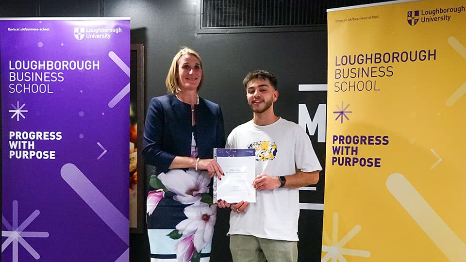 Josh Budd with their award certificate from Jan Godsell.