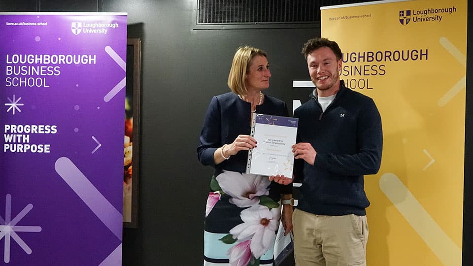 Niall Salmon with their award certificate from Jan Godsell.