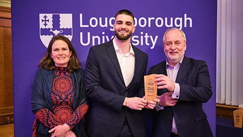 Mihajlo Jovanovic receiving an award from Nick Jennings and Justine Wood.