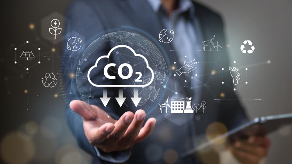 A man standing with palm outstretched and graphical representations of climate related icons around them.