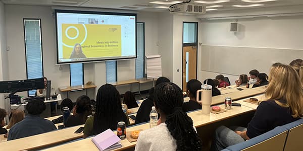 Students sitting in a lecture theatre.