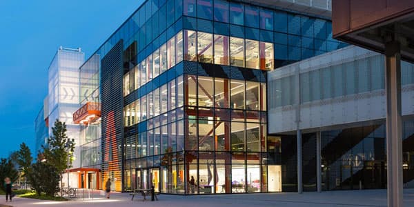 The Loughborough University London building with the lights on at night