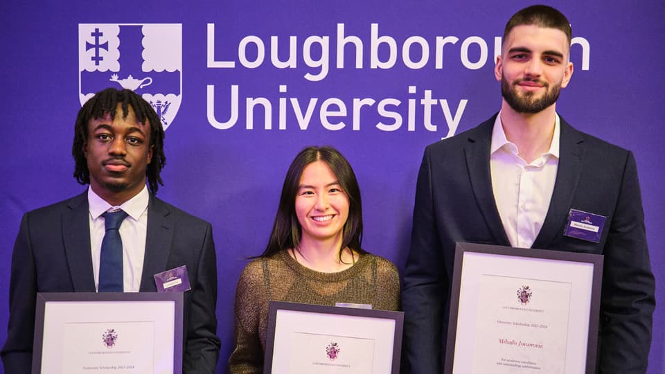 Jordan Addo-Antoine, Fawn Pu, and Mihajlo Jovanovic holding their Academic Excellence Awards.