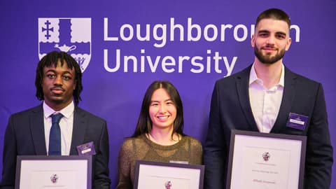 Jordan Addo-Antoine, Fawn Pu and Mihajlo Jovanovic holding their Academic Excellence Awards.