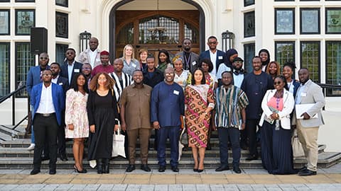 Representatives from Loughborough University and the Ghana Ministry of Youth Development and Empowerment standing together outside.