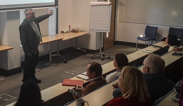 Huw Edwards presenting.