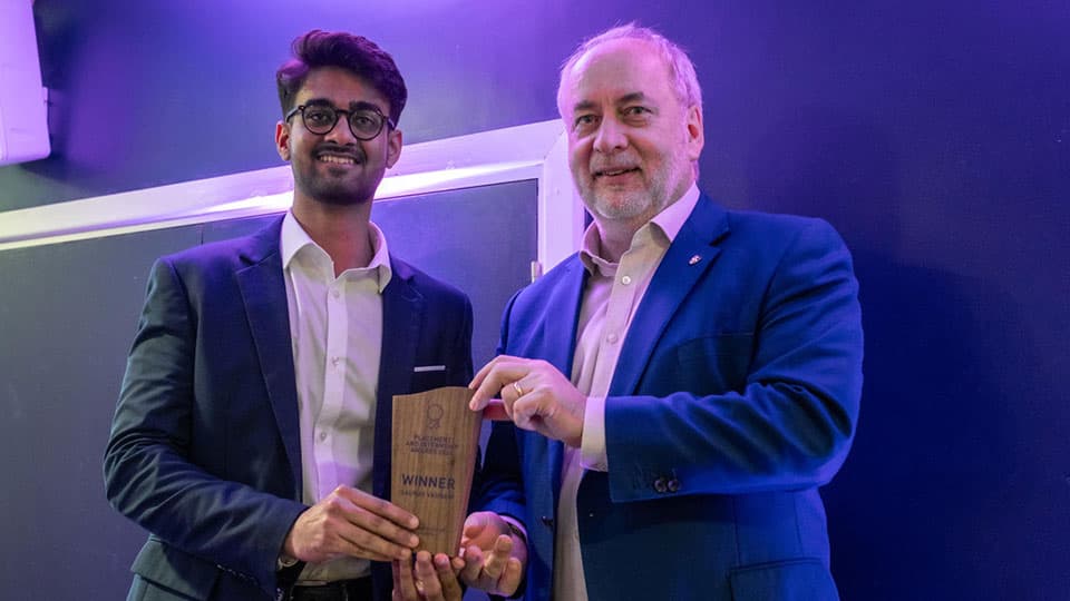 Gaurav Vasnani receiving an award from Nick Jennings.