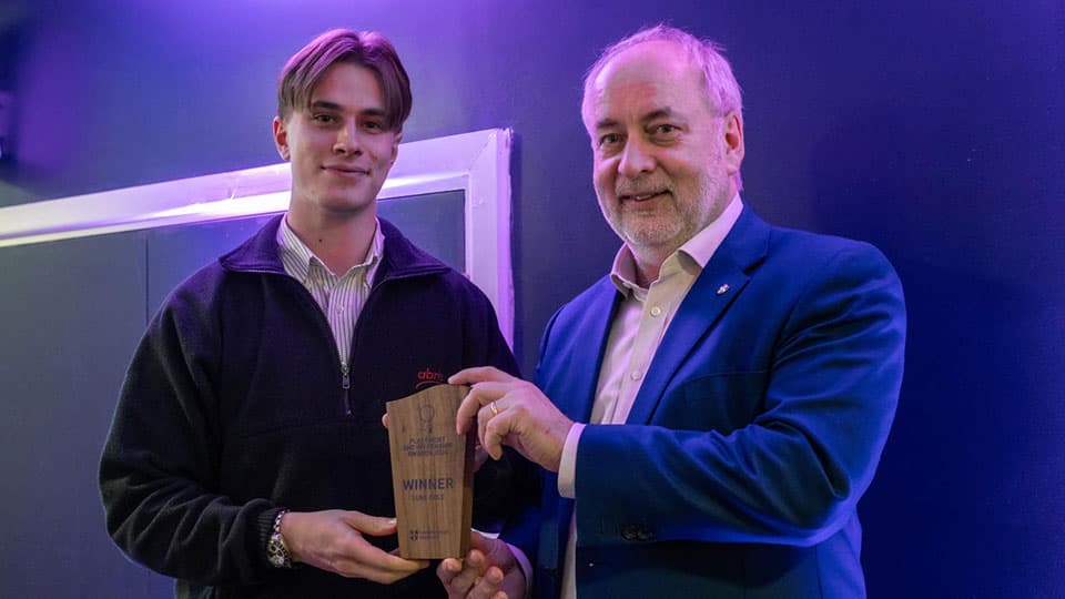 Luke Cole receiving an award from Nick Jennings.