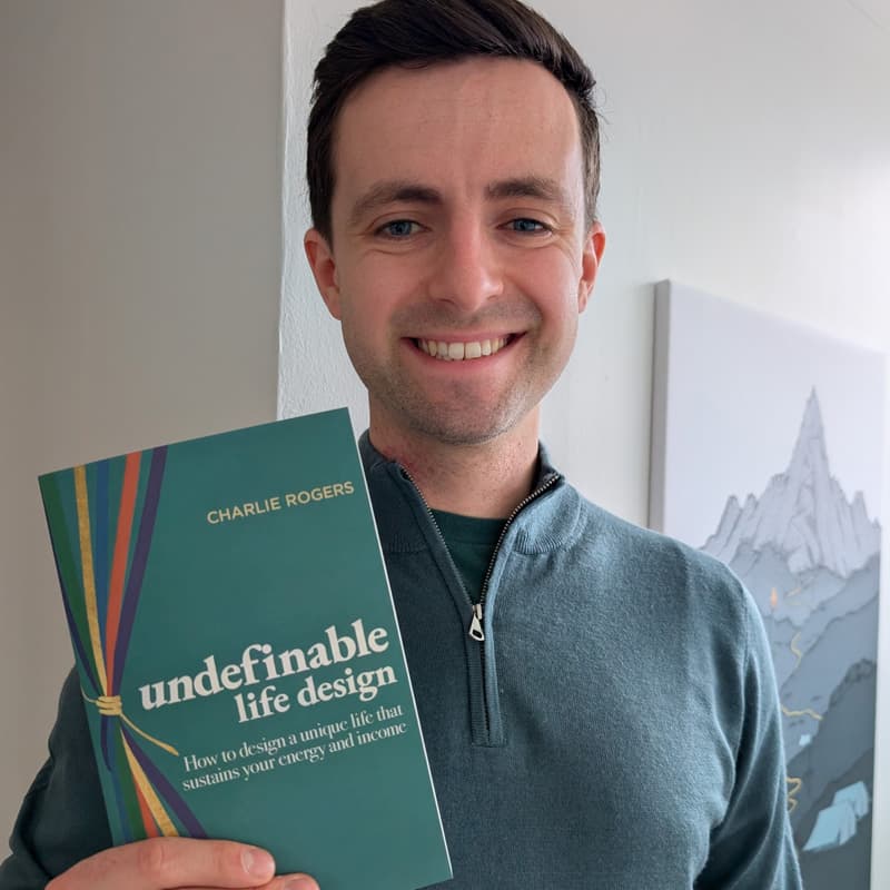 Charlie Rogers poses with his newly published book.