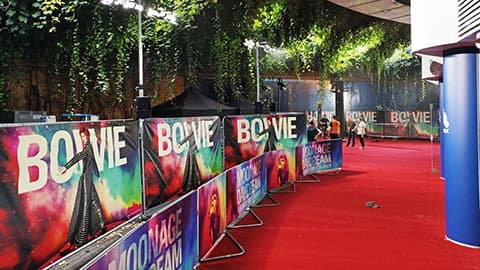 Red carpet and signage for the 'Moonage Daydream' movie premiere.