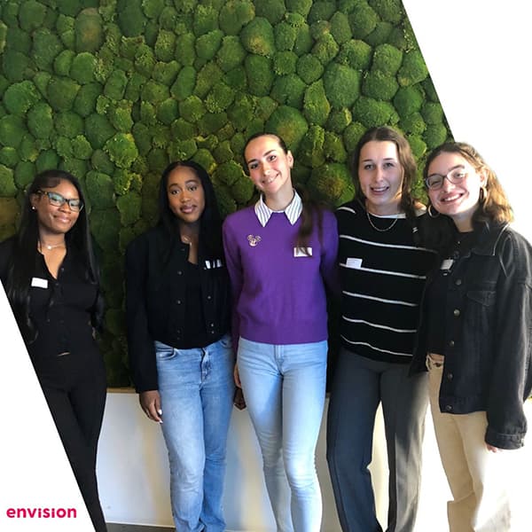 Ekaterina standing with a group of four other people.