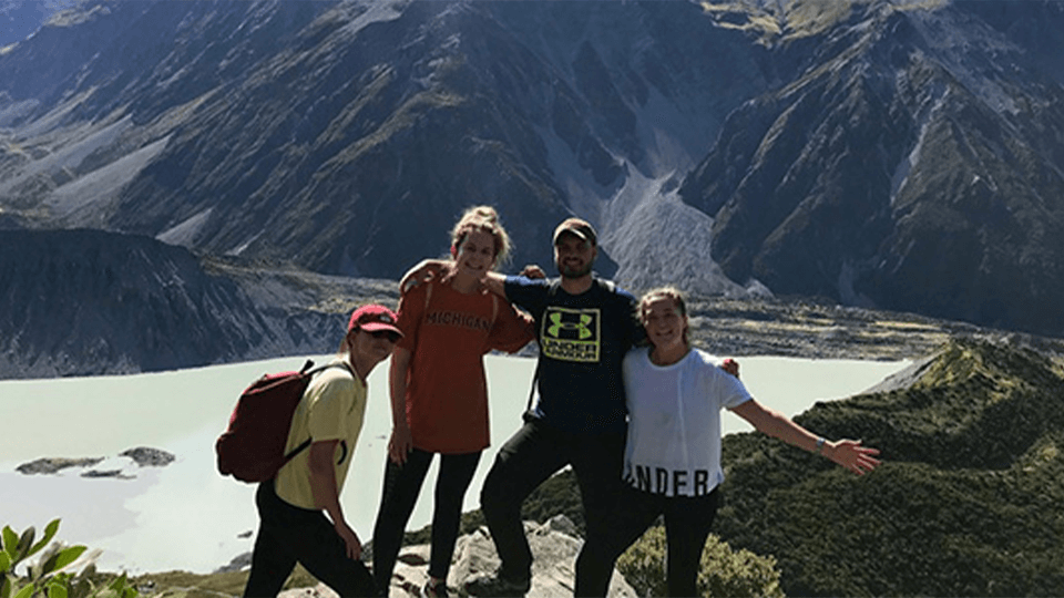 image of 4 students in the mountains