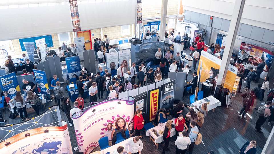 birdseye view of employability fair with stalls and people