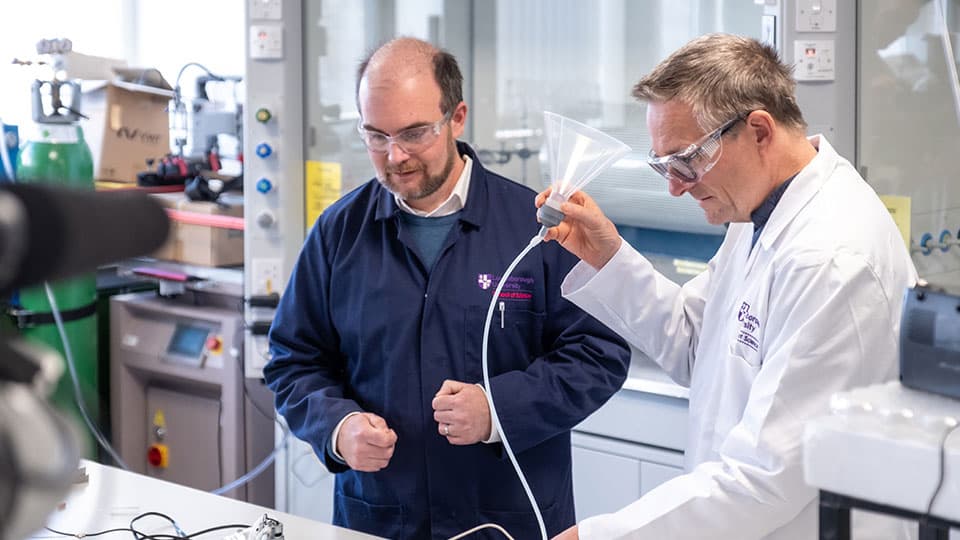 Dr Jim Reynolds and late Michael Mosley in lab coats