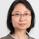 A headshot of Yanning Yang wearing glasses