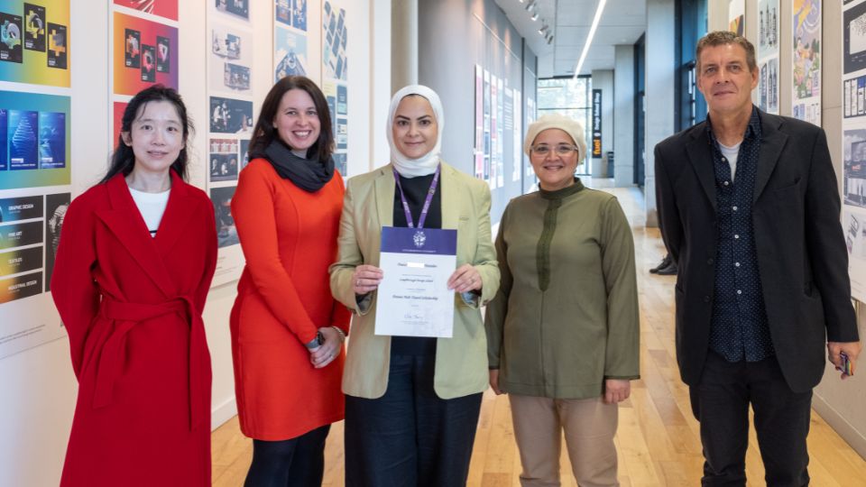 Dua's - Dennis Holt Travel Prize Winner stood with supporting staff