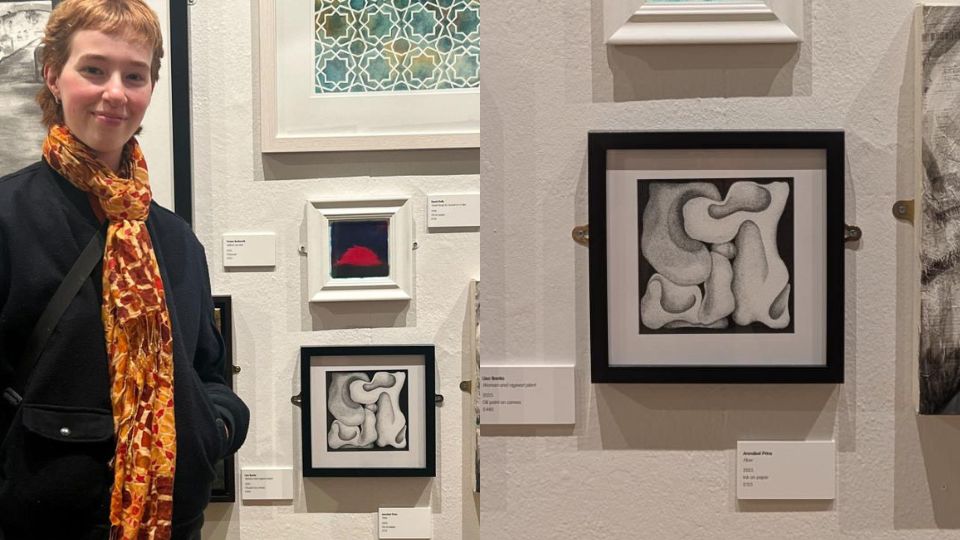 Annabel Prins standing next to her work