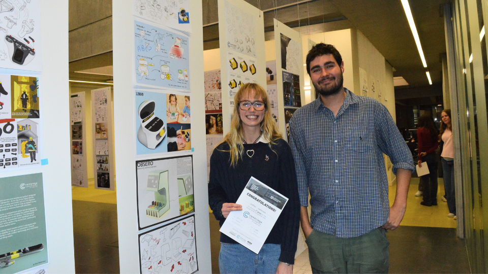 Georgia Vermeiren being awarded 3rd place with Cambridge Consultants