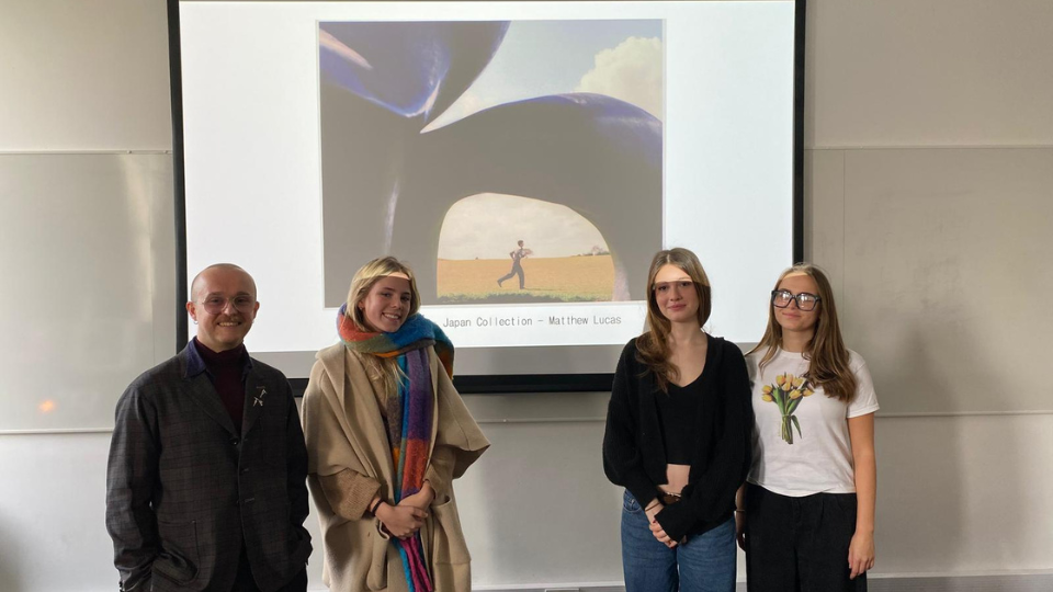 Matt Lucas, Menswear Designer at Paul Smith stood next to Fashon Design students