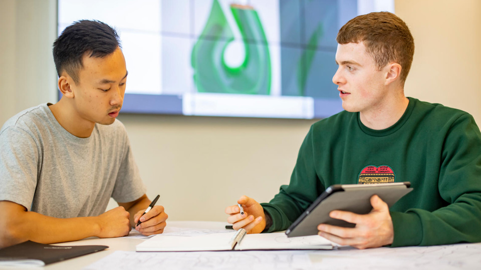 Students talking whilst working