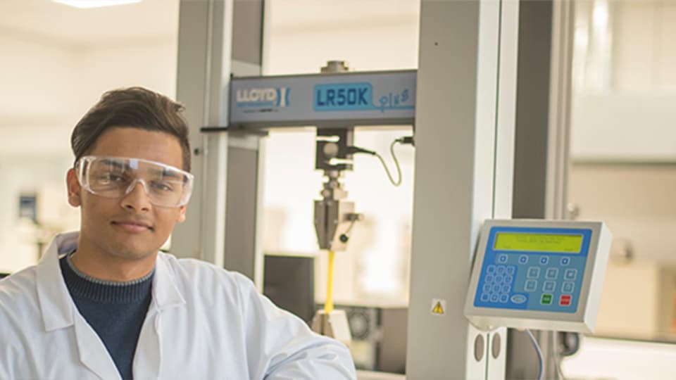 Image of male student smiling at camera