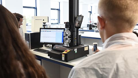 tensile tester equipment with students