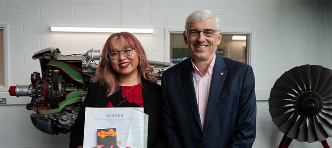 PhD student, Huyen, stood with Dean of AACME, Chris Rielly