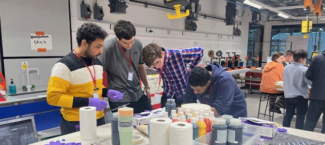 a group of students working on their project at the Graphene Hackathon