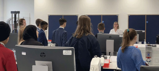 the group of students from De Lisle College visiting a science lab