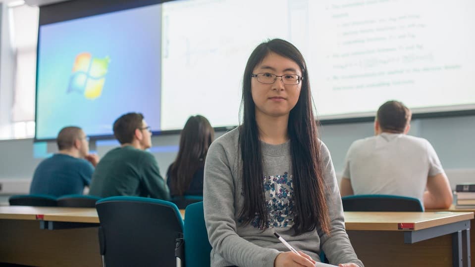 students in class, one facing the camara