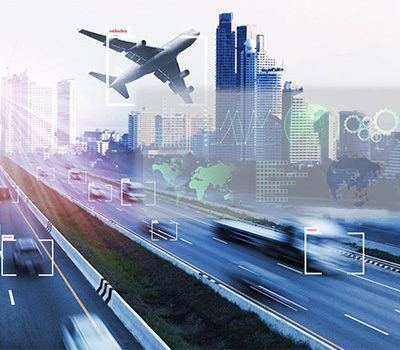 An illustration of vehicles, buildings and aeroplanes and a busy road