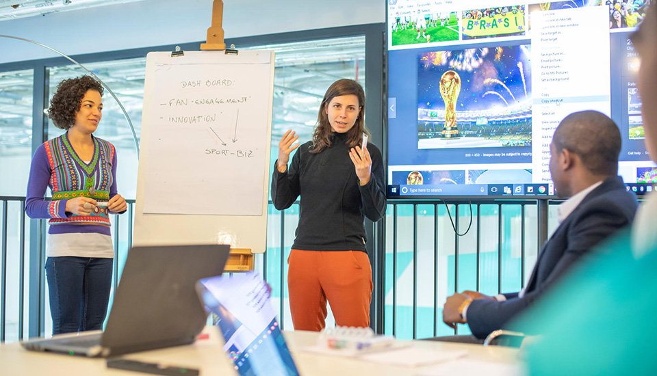 Students presenting in a business setting