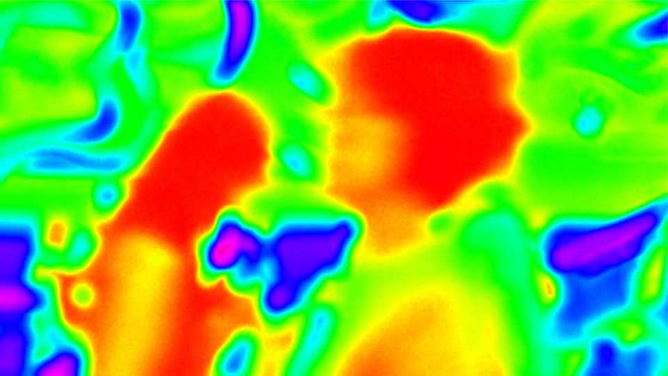 Data showing an infrared thermal scanner monitoring a number of human body temperatures shown in the colours, blue, green and red.