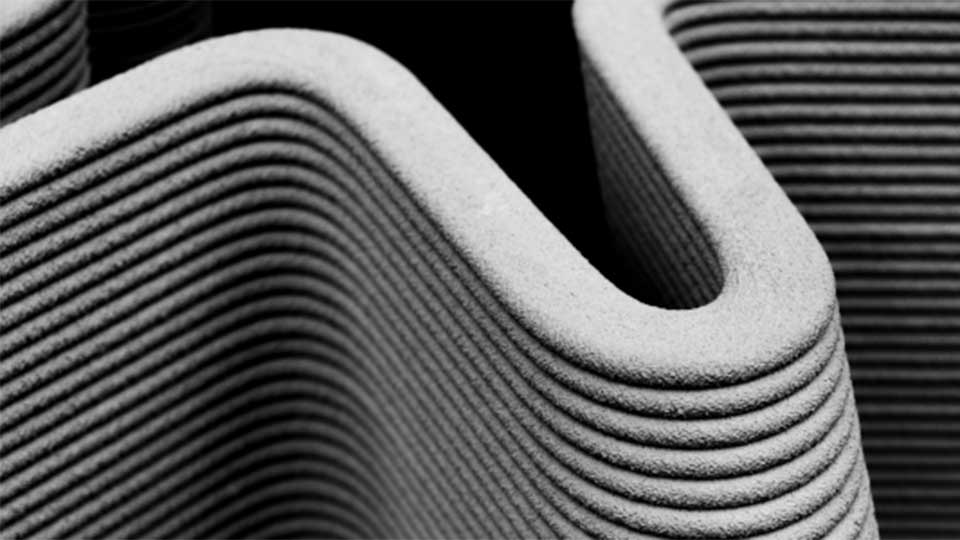 An extreme close-up of a grey asset showing the printing process using investment casting.