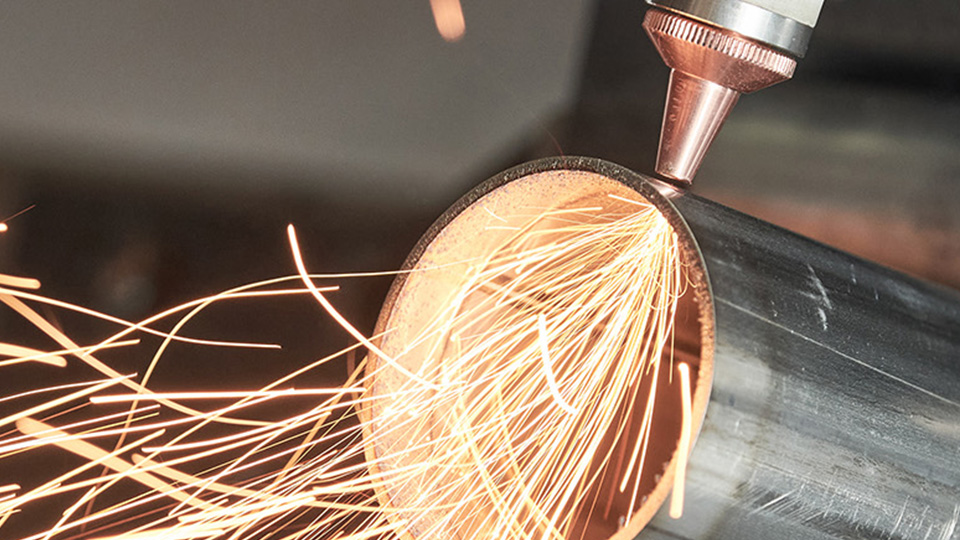 Lazer cutting equipment showing sparks of fire