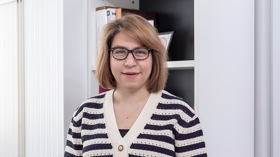 Mahsa stood in her office