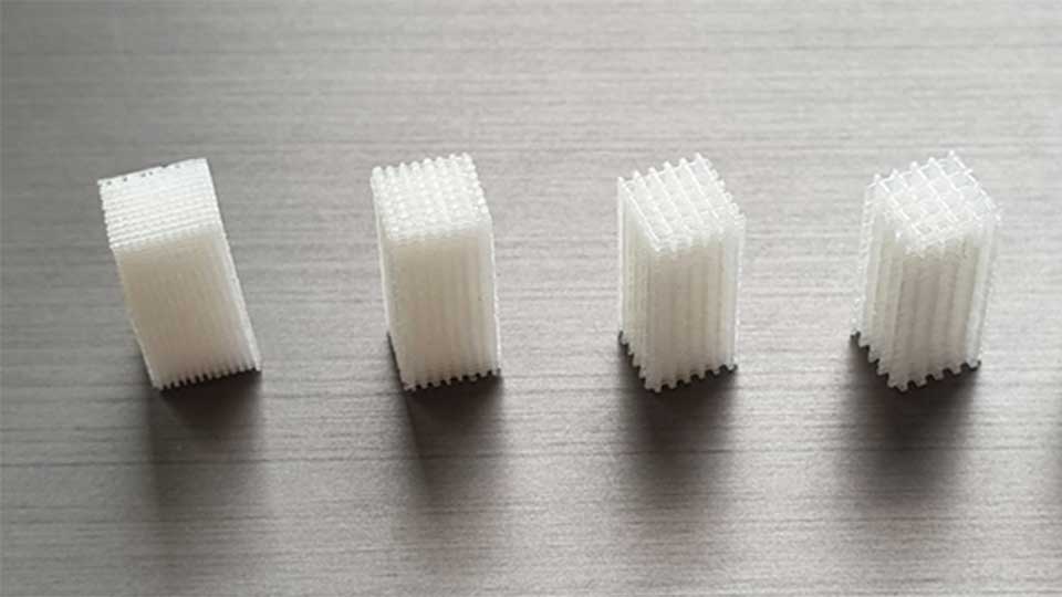 Five white oblong-shaped 3D-printed prototypes