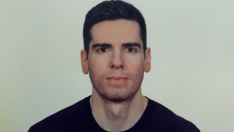 Panos standing against a grey background