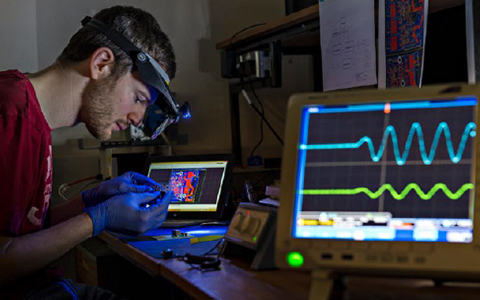 Student on a computer in an engineering lab
