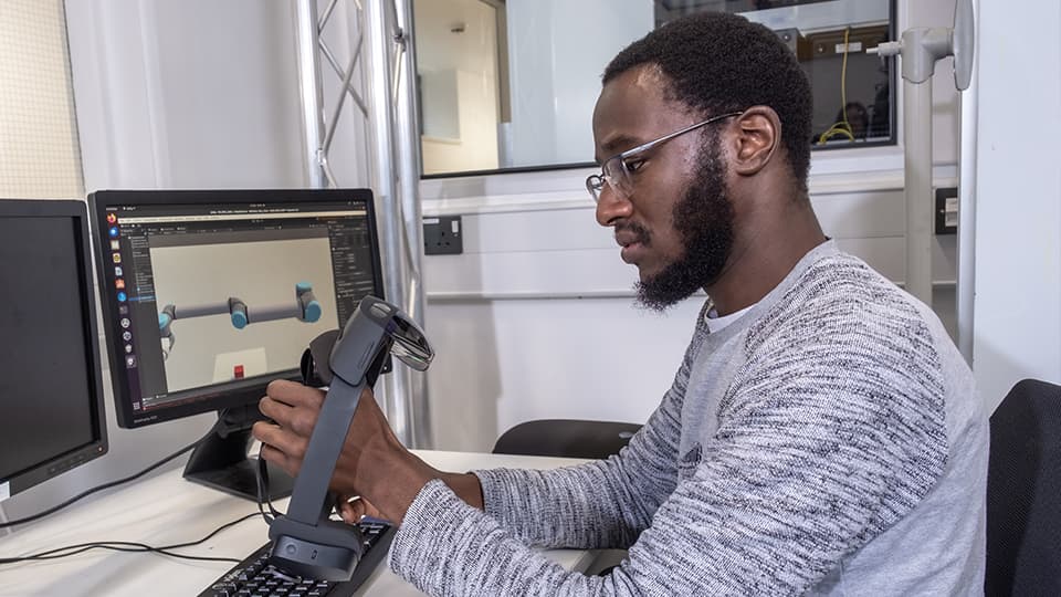 Isaiah in an engineering lab