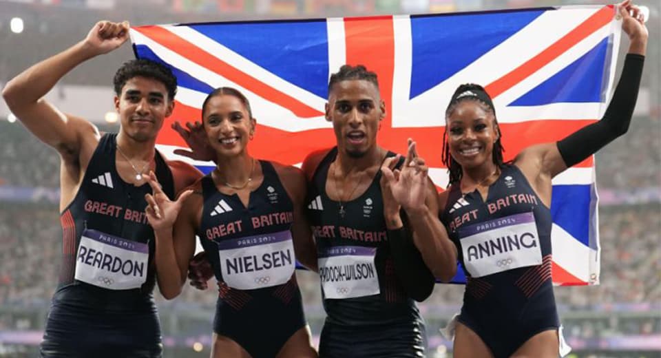 Four runners with Great Britain flag
