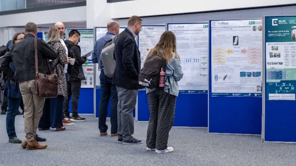 Students looking around poster display