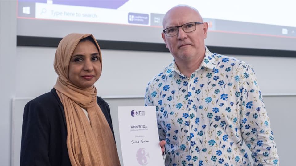 Samia being presented with a certificate