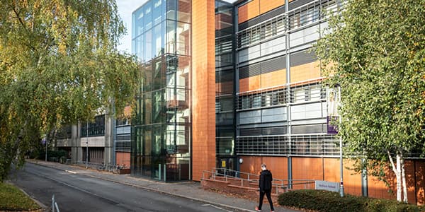 Student walking outside university building