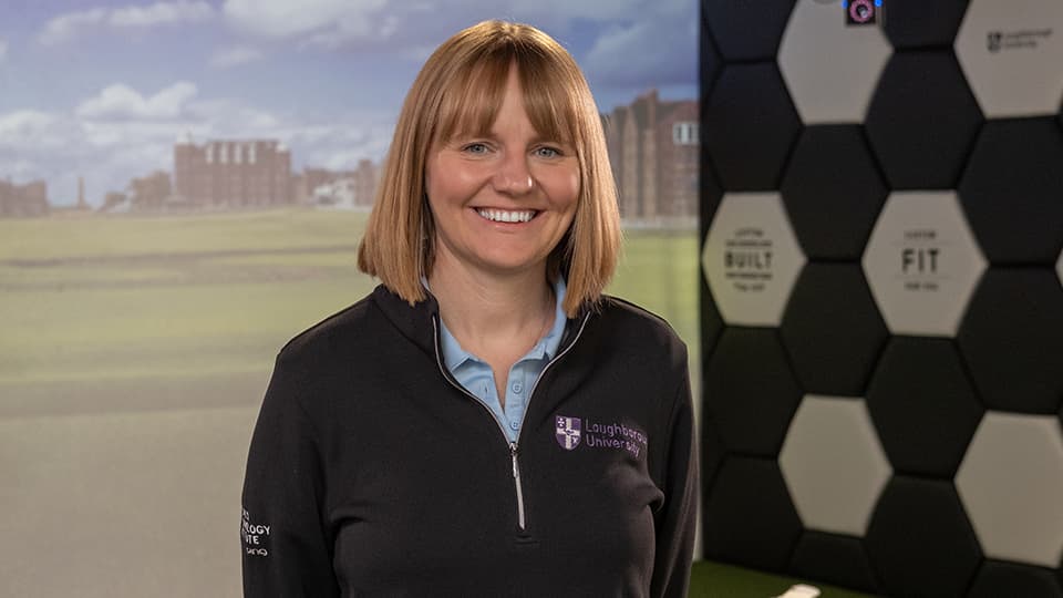 Amiee stood next to golf background