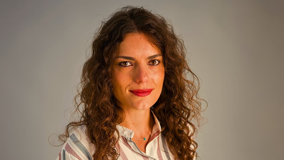 Manuela against grey background