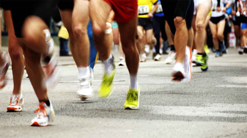 Feet of road race runners