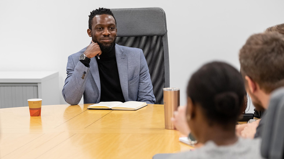 Student in a business meeting