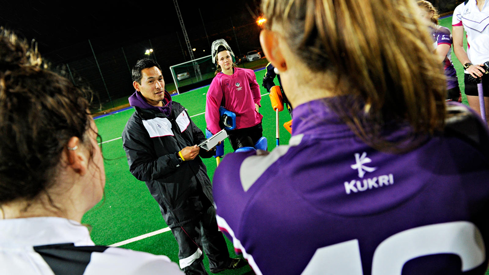 Coach talking to players