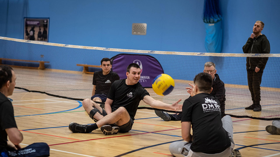Para-athletes playing volleyball